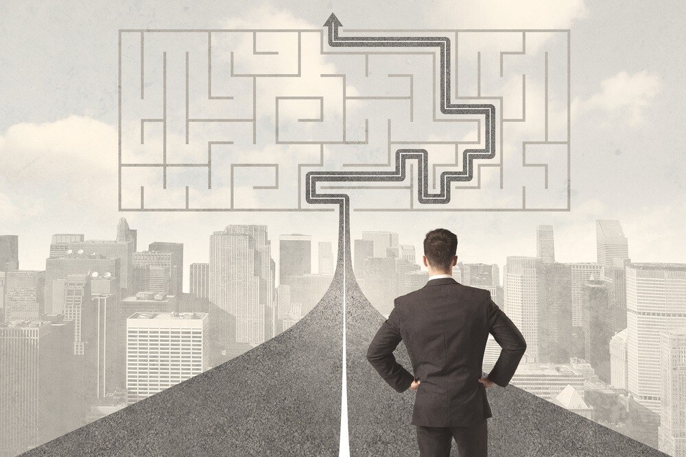Businessman looking at road with maze and solution concept-1-1